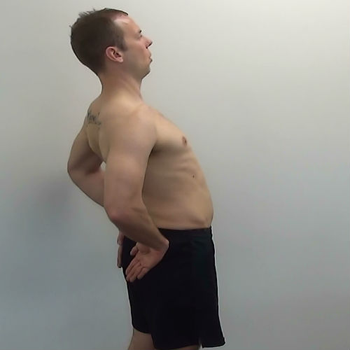 Standing back extension stretch demonstration