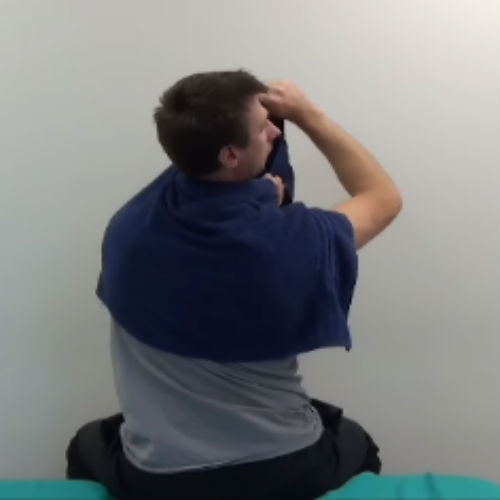 Towel assisted neck rotation demonstration